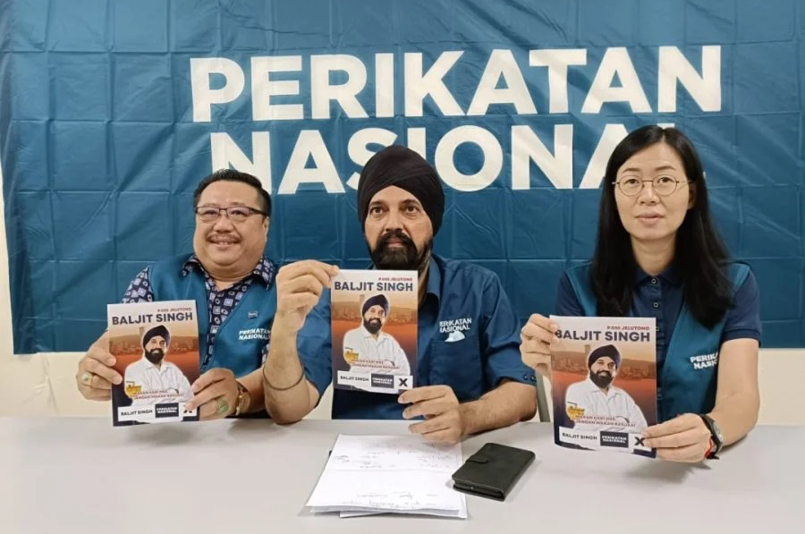 民政党峇日星竞选口号 　“吃咖喱面，不要吃钱”